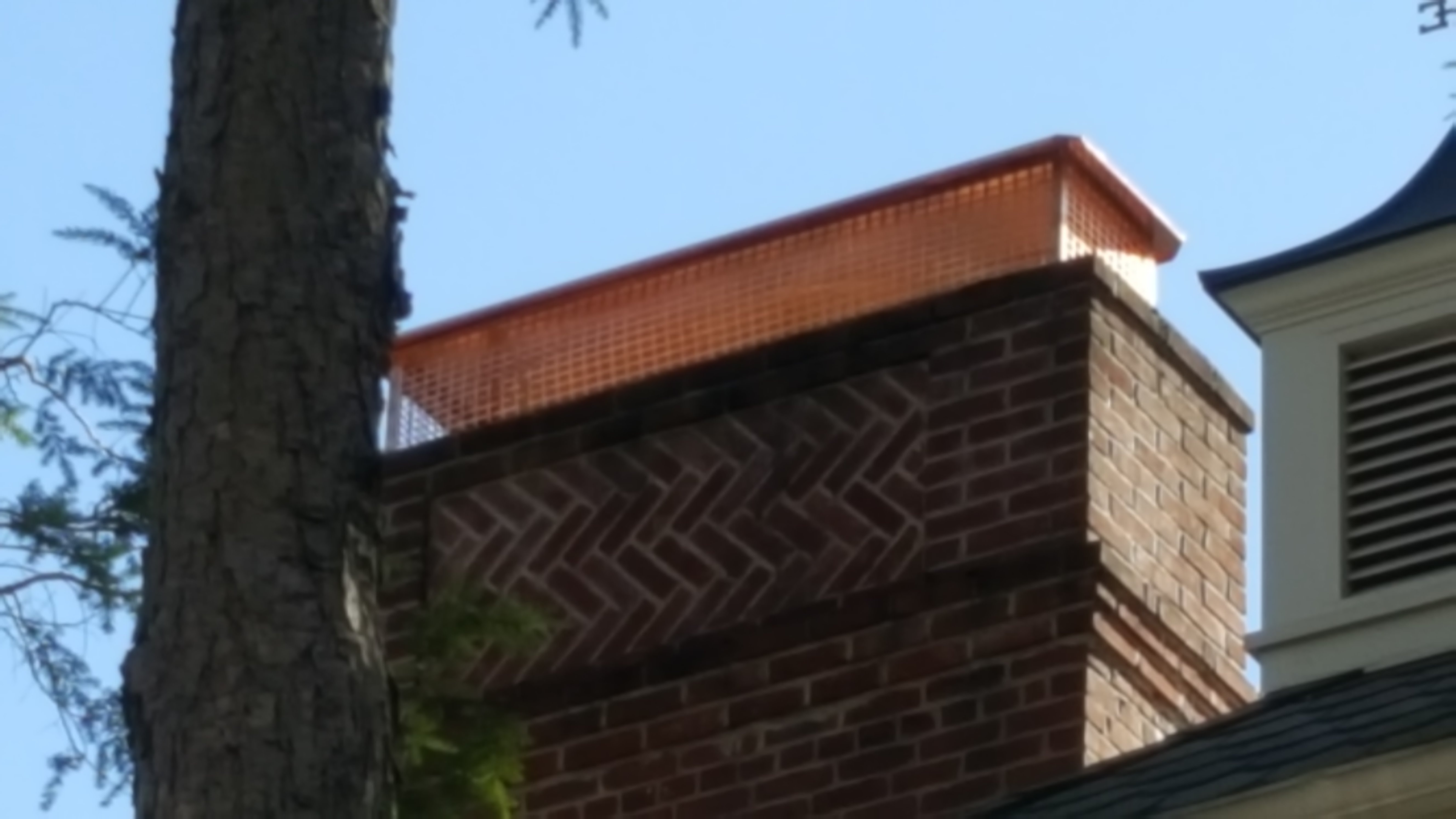 New stainless steel chimney cap installed in Plainview, NY