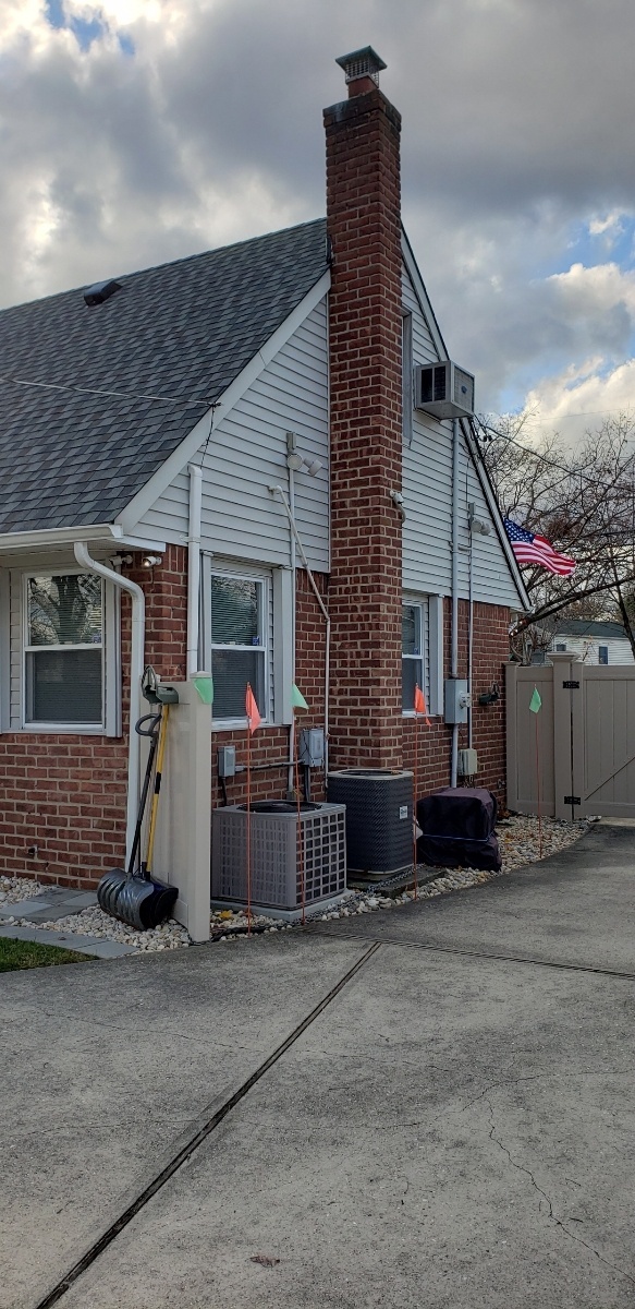 Professional chimney repointing restoring brick joints in Plainview, NY