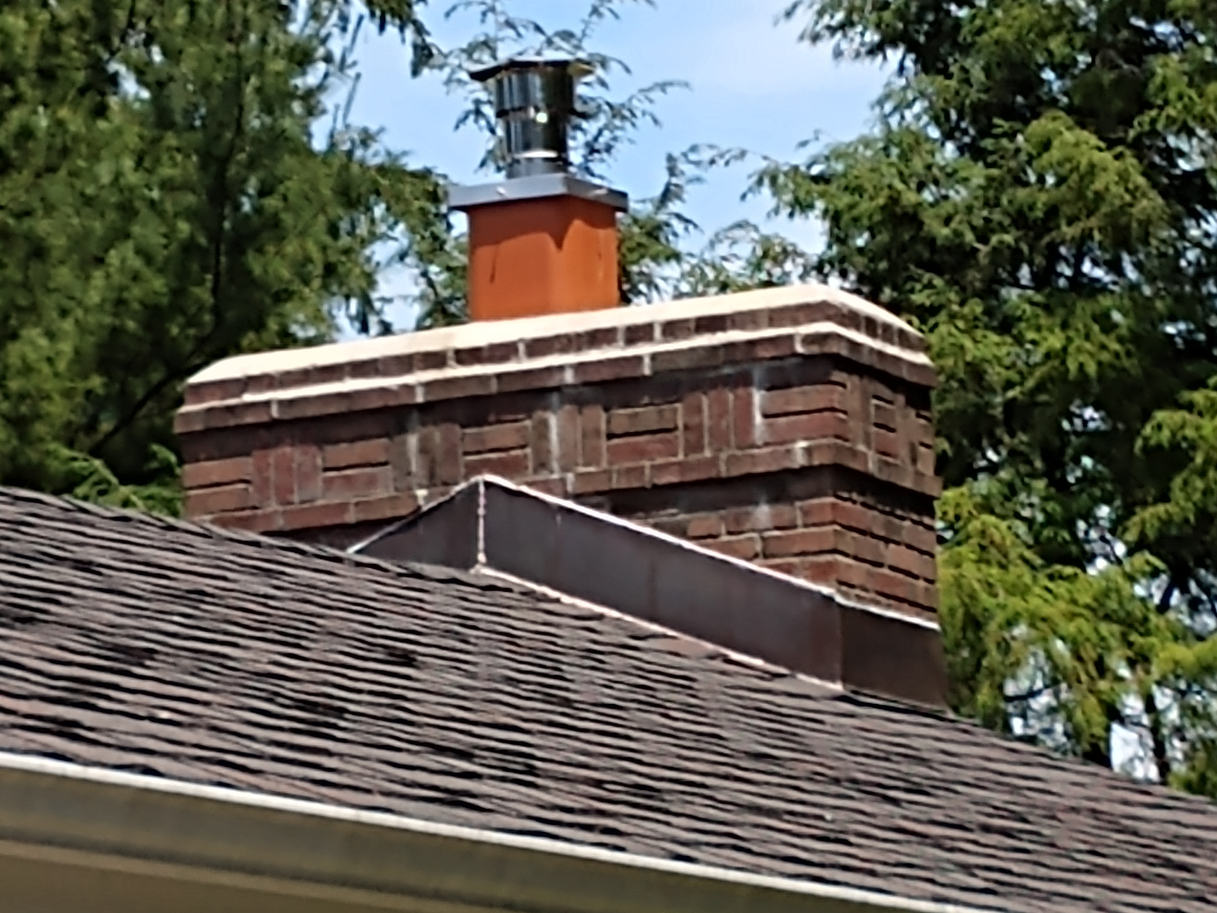 Stainless steel chimney cap with animal guard in Plainview, New York